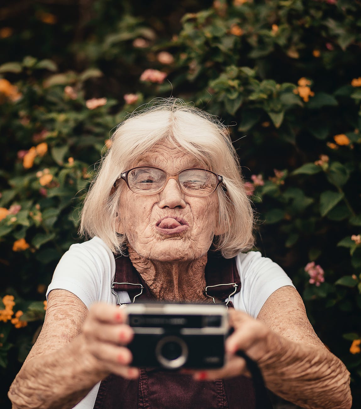 old woman / granny  taking a funny selfie